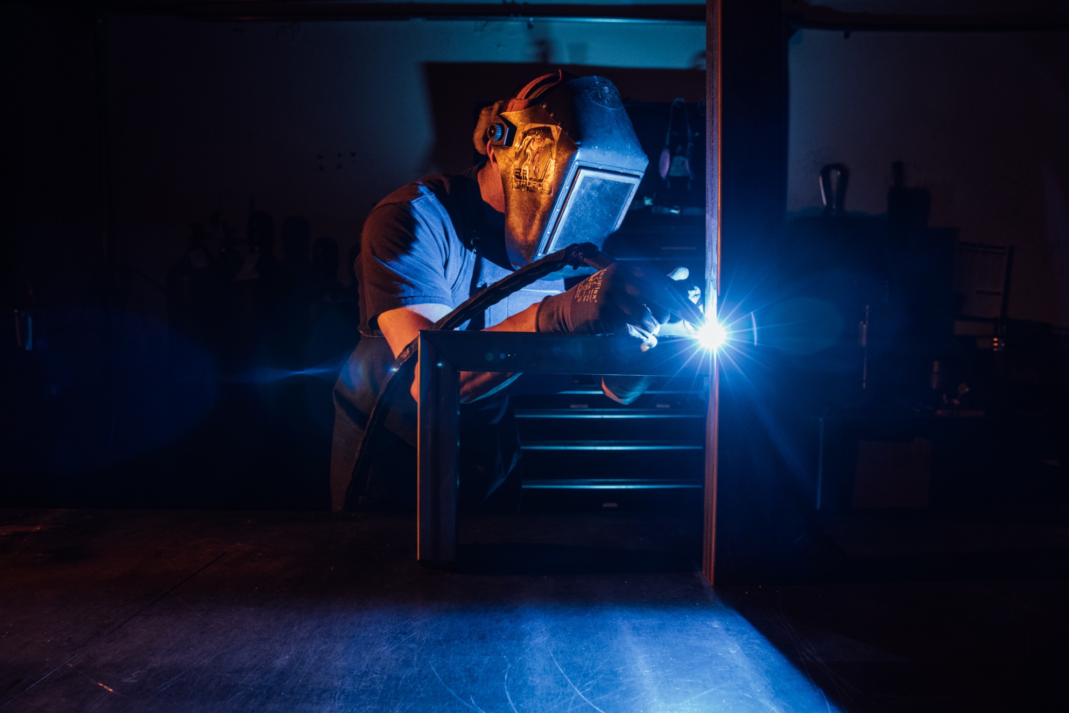 Jones welder fabricating a steel frame in the shop