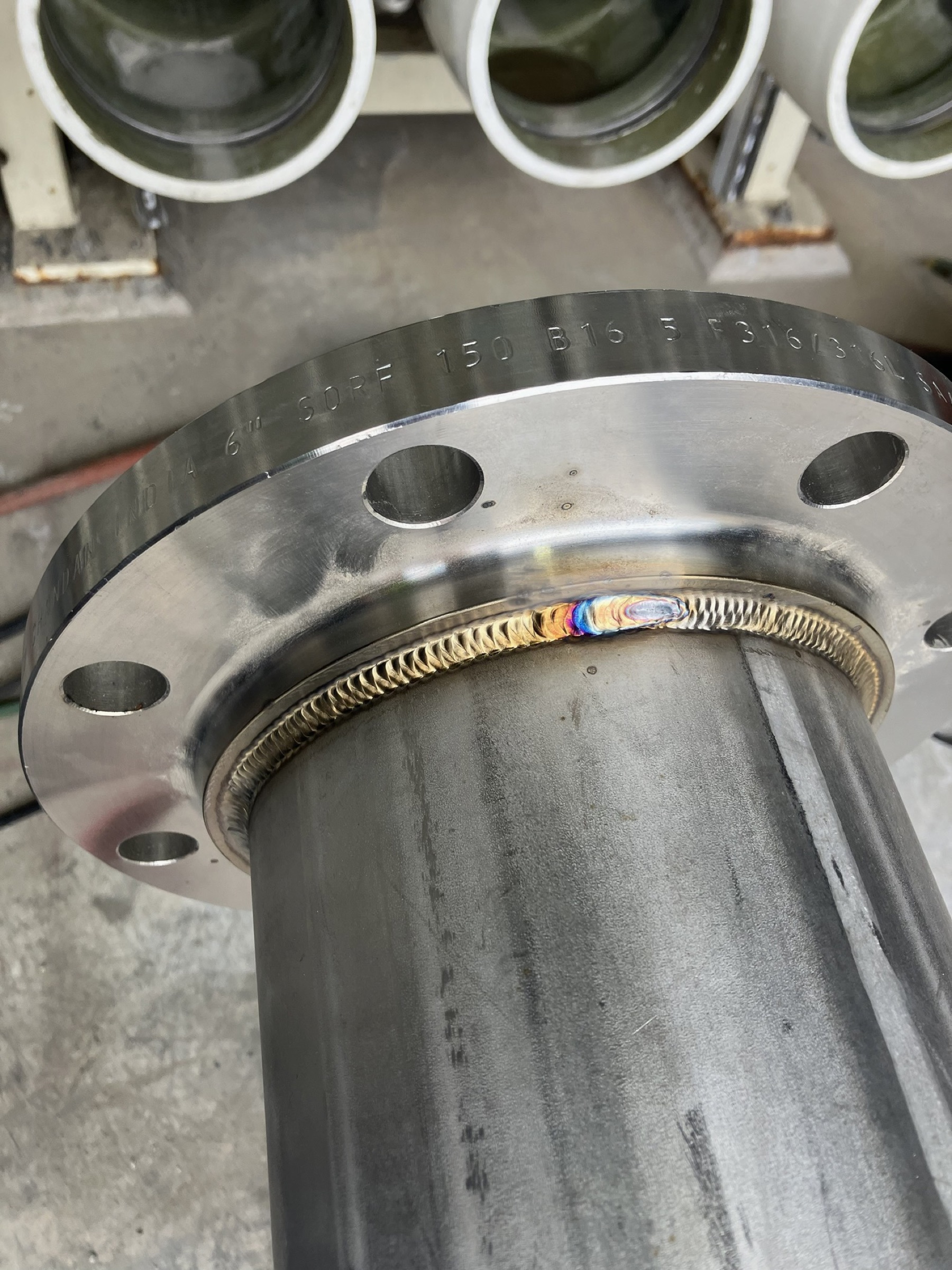 Close view of a precision stainless flange weld